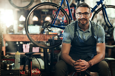 Buy stock photo Portrait, smile and technician man in bicycle shop, store or cycling repair workshop. Face, bike mechanic and male person, confident business owner or mature professional from Canada with glasses.
