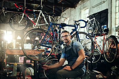 Buy stock photo Portrait, wrench and mechanic man in bicycle shop, store or cycling repair workshop. Face, bike technician and male person, serious business owner or mature professional with glasses and confidence.