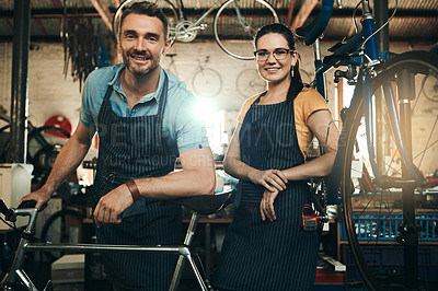 Buy stock photo Portrait, people and bicycle shop with repair job of mechanic, technician and maintenance work. Workshop, service and happy business owner with employee and bike for fixing with apron and pride