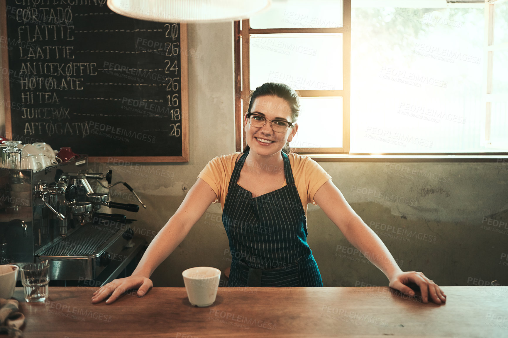 Buy stock photo Portrait of a young barista working in her coffee shop