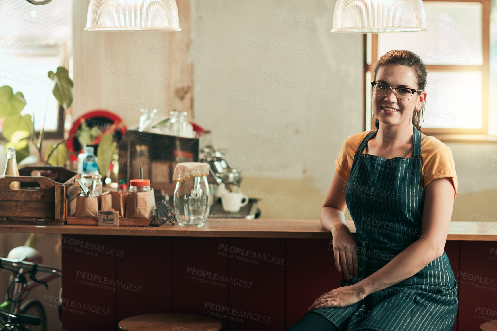 Buy stock photo Portrait of a young barista working in her coffee shop