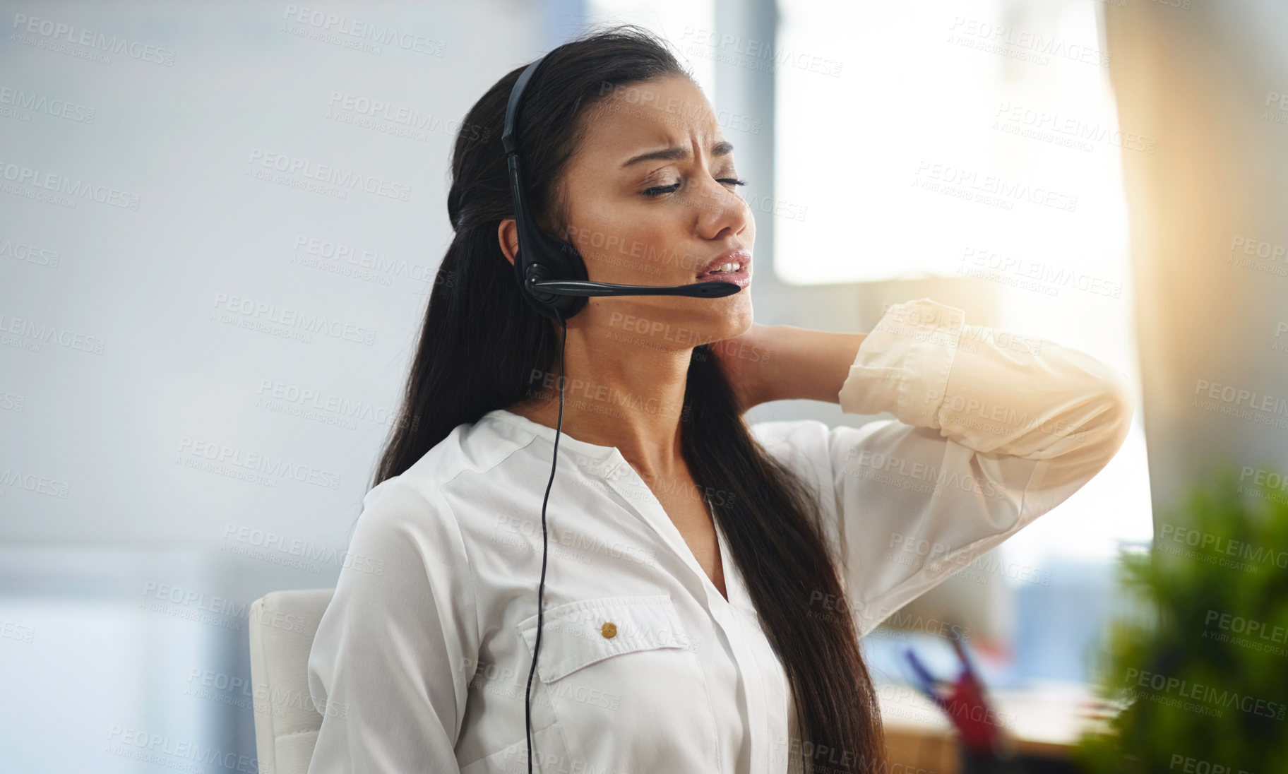 Buy stock photo Stress, burnout or woman in call center with back pain injury while working in telecom help desk office. Consultant, injured agent or tired sales girl with joint pain emergency, fatigue or accident