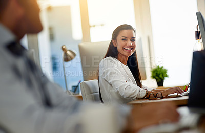 Buy stock photo Shot of a young woman working in an office