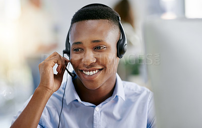 Buy stock photo Shot of a male agent working in a call centre