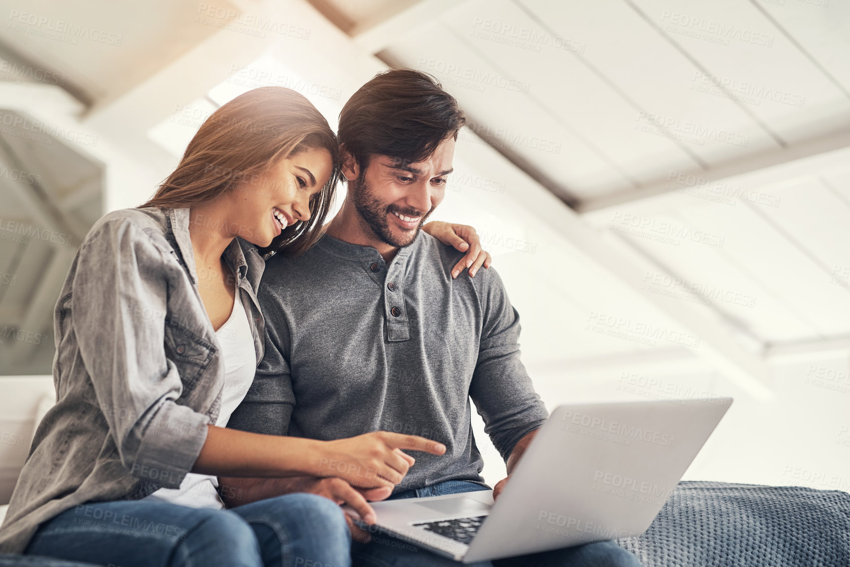 Buy stock photo Shot of an attractive young couple spending quality time at home