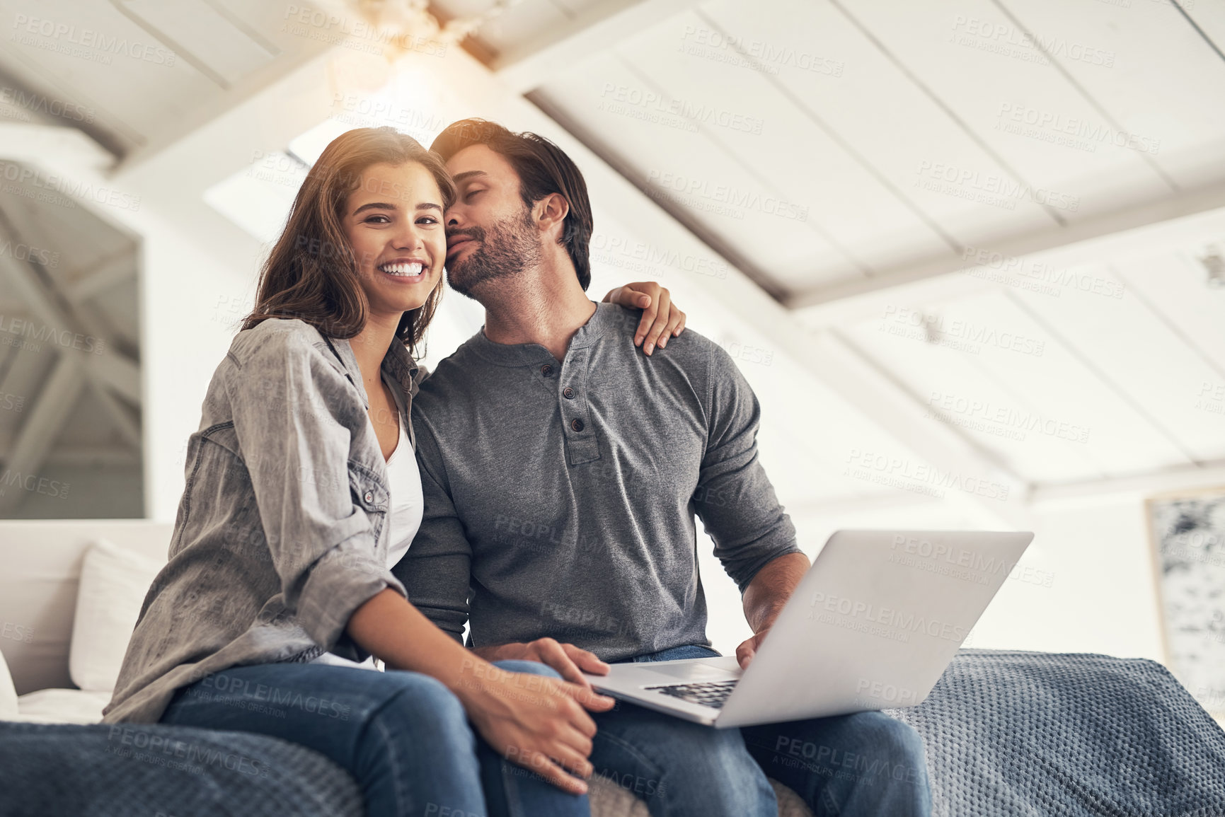 Buy stock photo Shot of an attractive young couple spending quality time at home