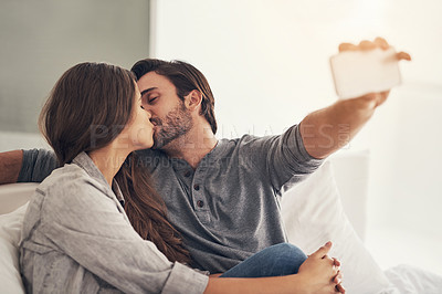 Buy stock photo Shot of an attractive young couple spending quality time at home