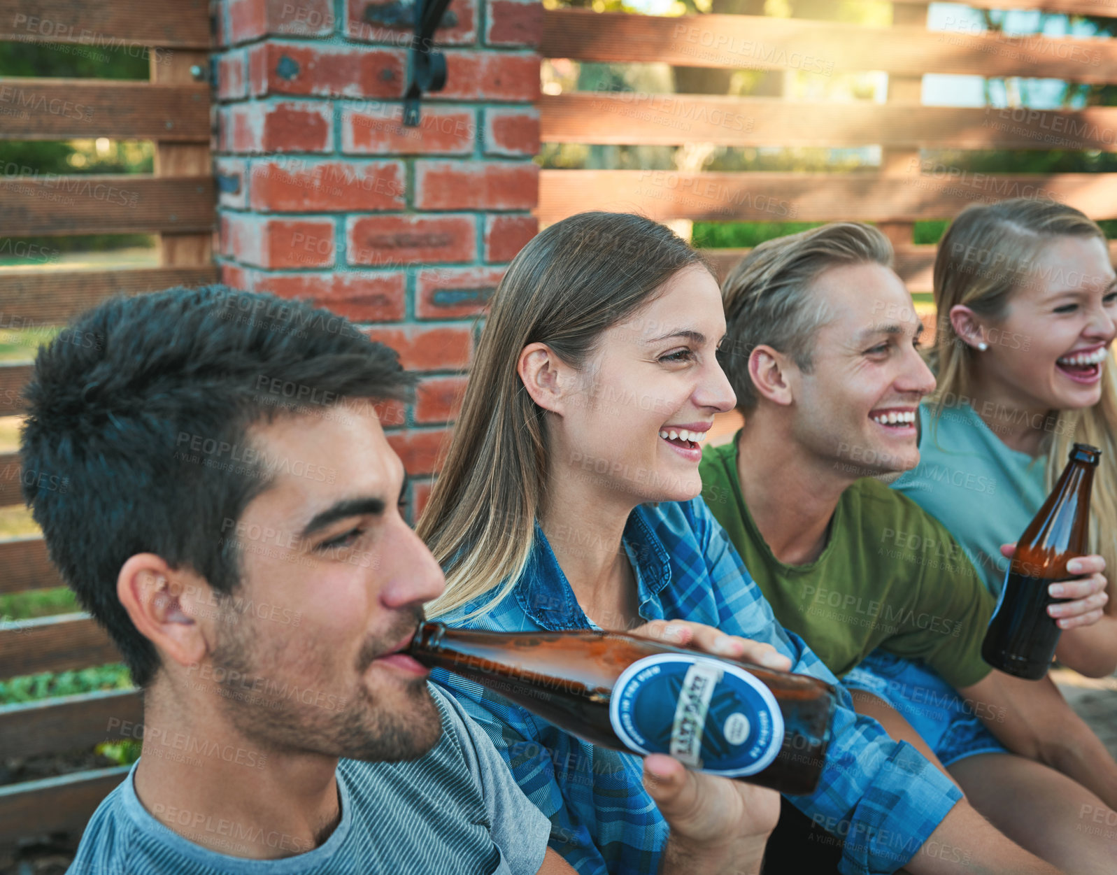 Buy stock photo Friends, beer and outdoor of home on patio with drink, laughing and labor day fun at party. Summer, backyard and happy people with alcohol, conversation and joke at group reunion and social event
