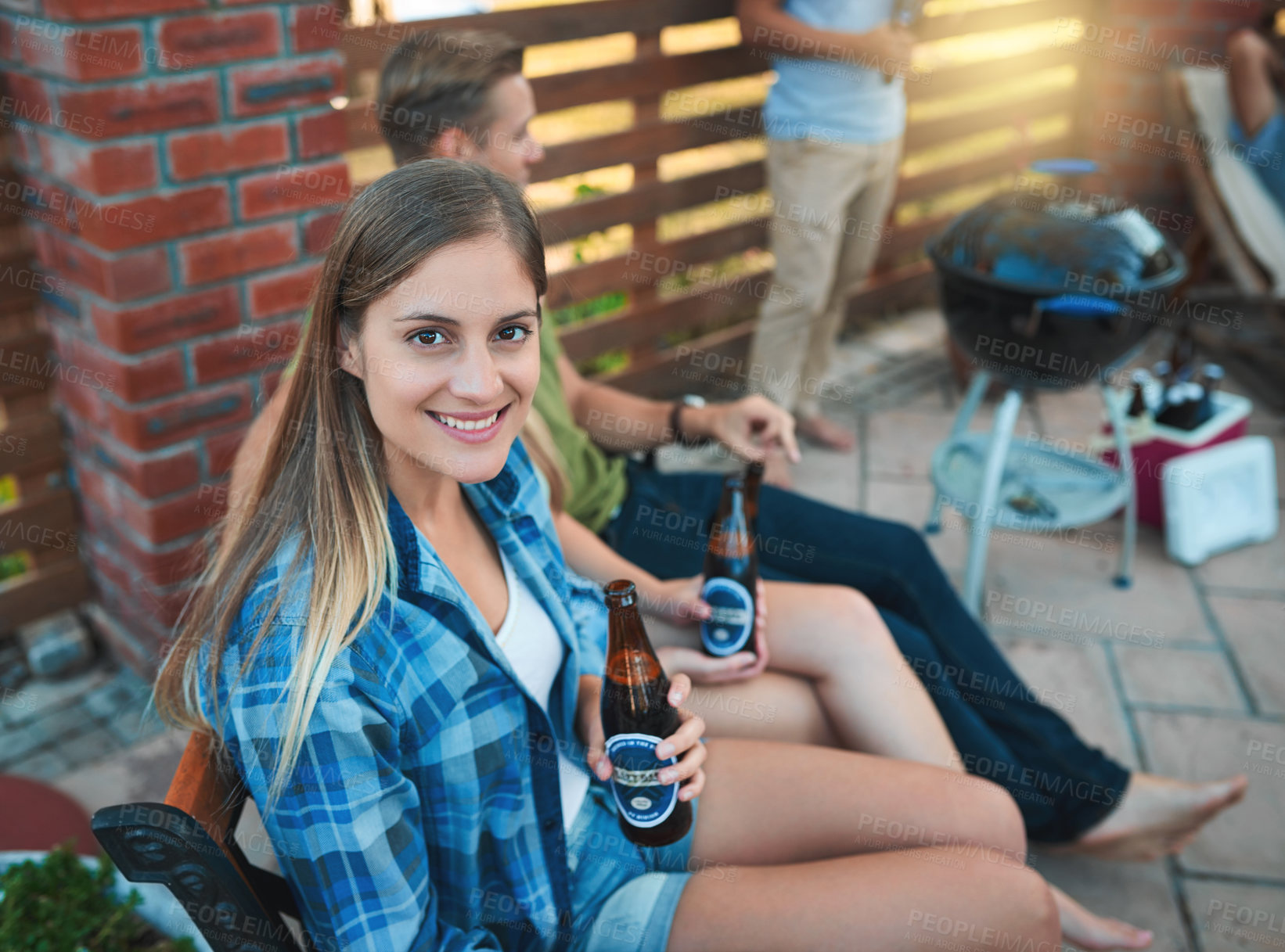 Buy stock photo Woman, beer and outdoor barbecue at party or celebration of holiday in summer with friends in backyard or patio. Portrait of people with beverage, drinks or alcohol bottle for hangout and bbq at home