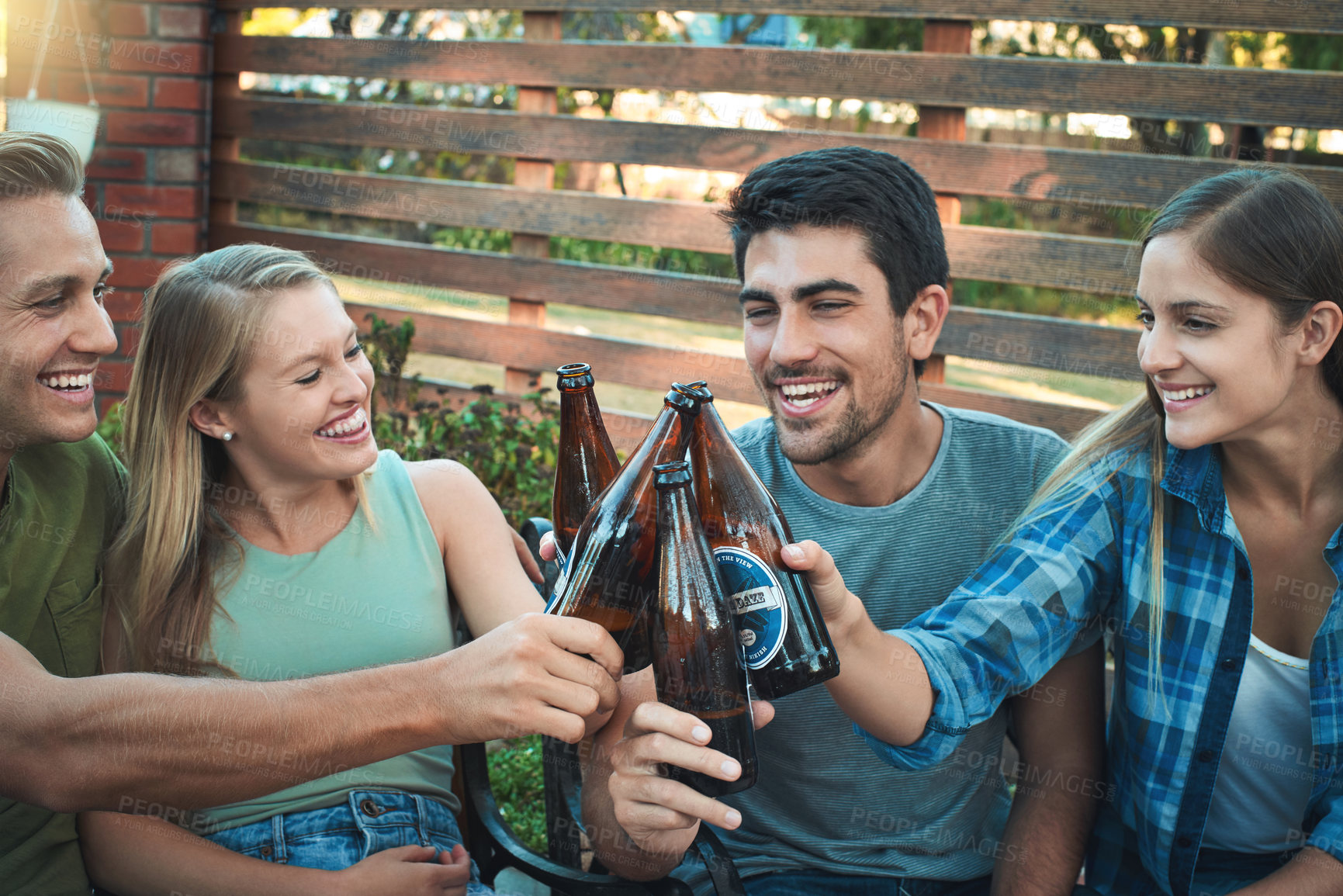 Buy stock photo Couple of friends, beer and backyard party with cheers for summer celebration and happy social hangout. Group of people laugh and toast together with beverage, drinks or alcohol bottle at home patio