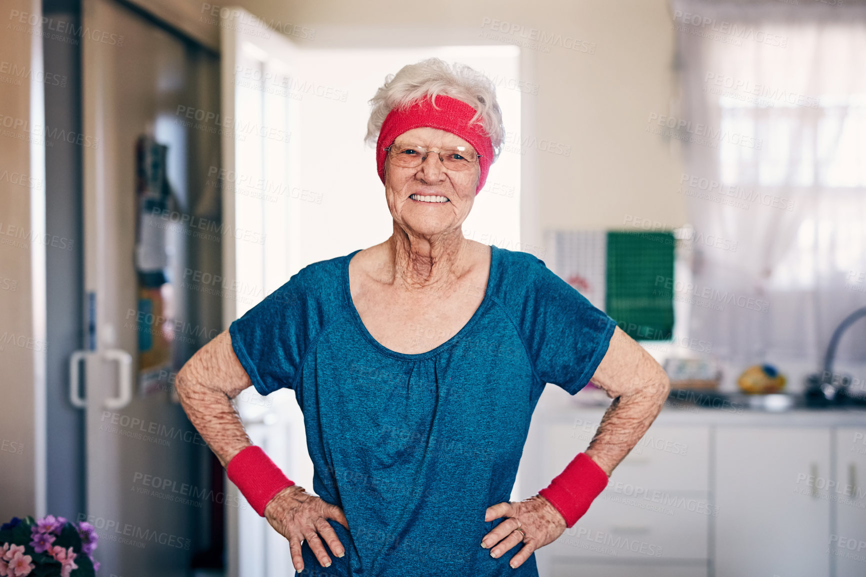 Buy stock photo Shot of a senior woman exercising at home