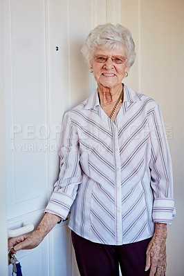 Buy stock photo Portrait of an elderly woman putting keys into the door at home