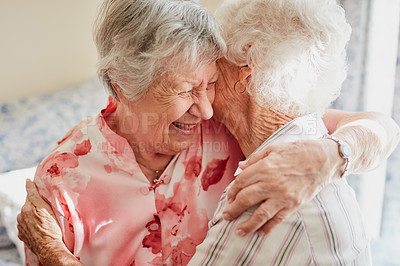 Buy stock photo Happy, hug and senior woman friends laughing in the bedroom of a retirement home together. Smile, reunion and laughter with an elderly female pensioner and friend bonding indoor during a visit