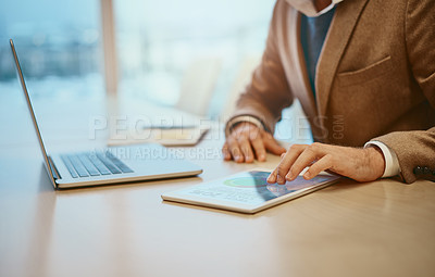 Buy stock photo High angle shot of an unrecognizable male designer working at his desk in the office
