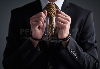 Buy stock photo Businessman, handcuffs and noose tie with corporate stress, finance debt and economy pressure. Model, metaphor and cost crisis with financial bondage, failure and execution on gray studio background