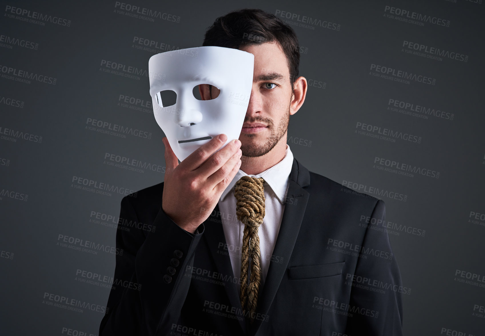 Buy stock photo Two faces, holding mask and businessman portrait in a studio with serious face with secret and fraud. Worker or corporate criminal with rope tie showing identity theft or liar in business suit mockup