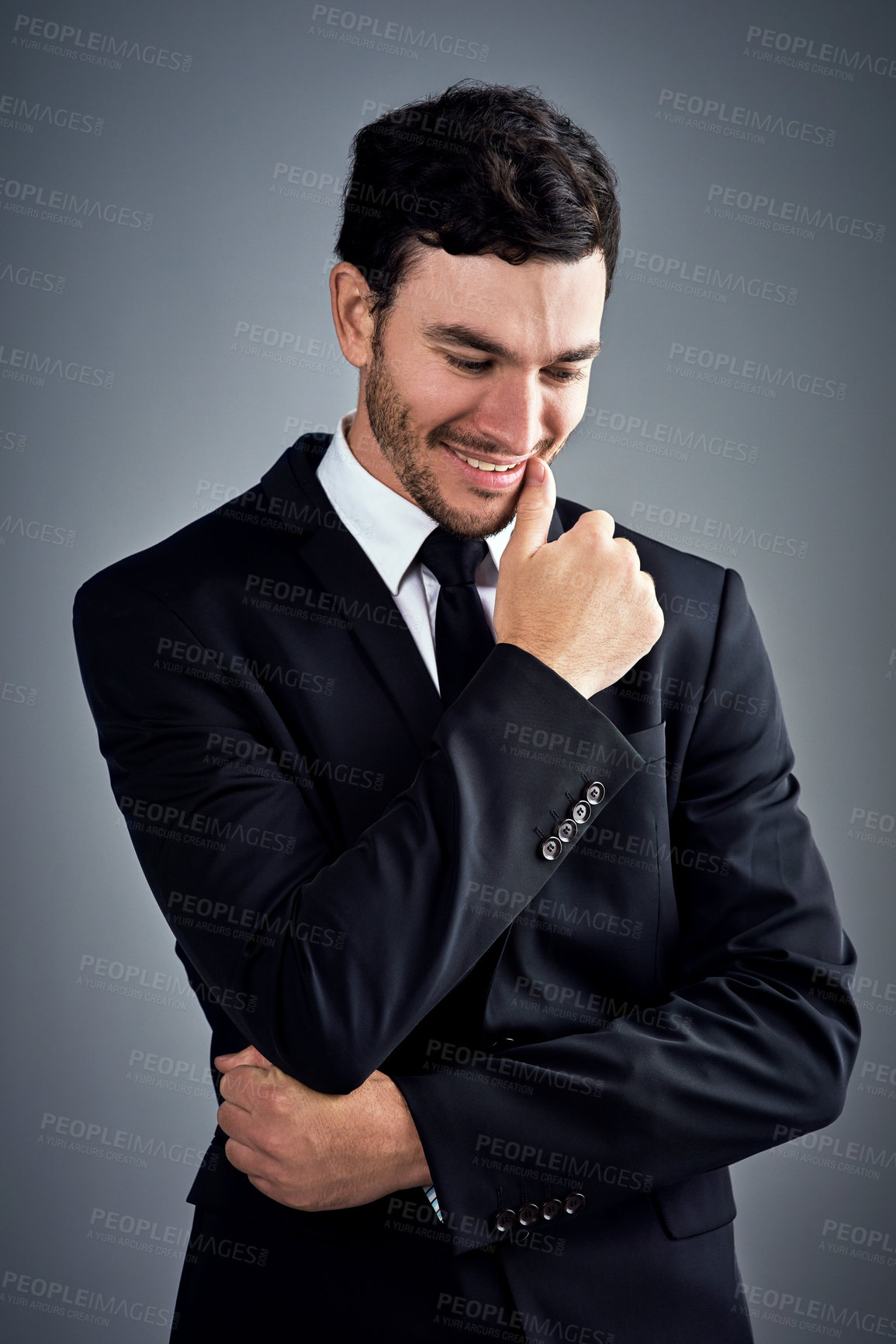 Buy stock photo Business, man and smile in studio for fashion or office wear with confidence on grey background. Male person, entrepreneur and happy with looking down as lawyer for career growth or job opportunity