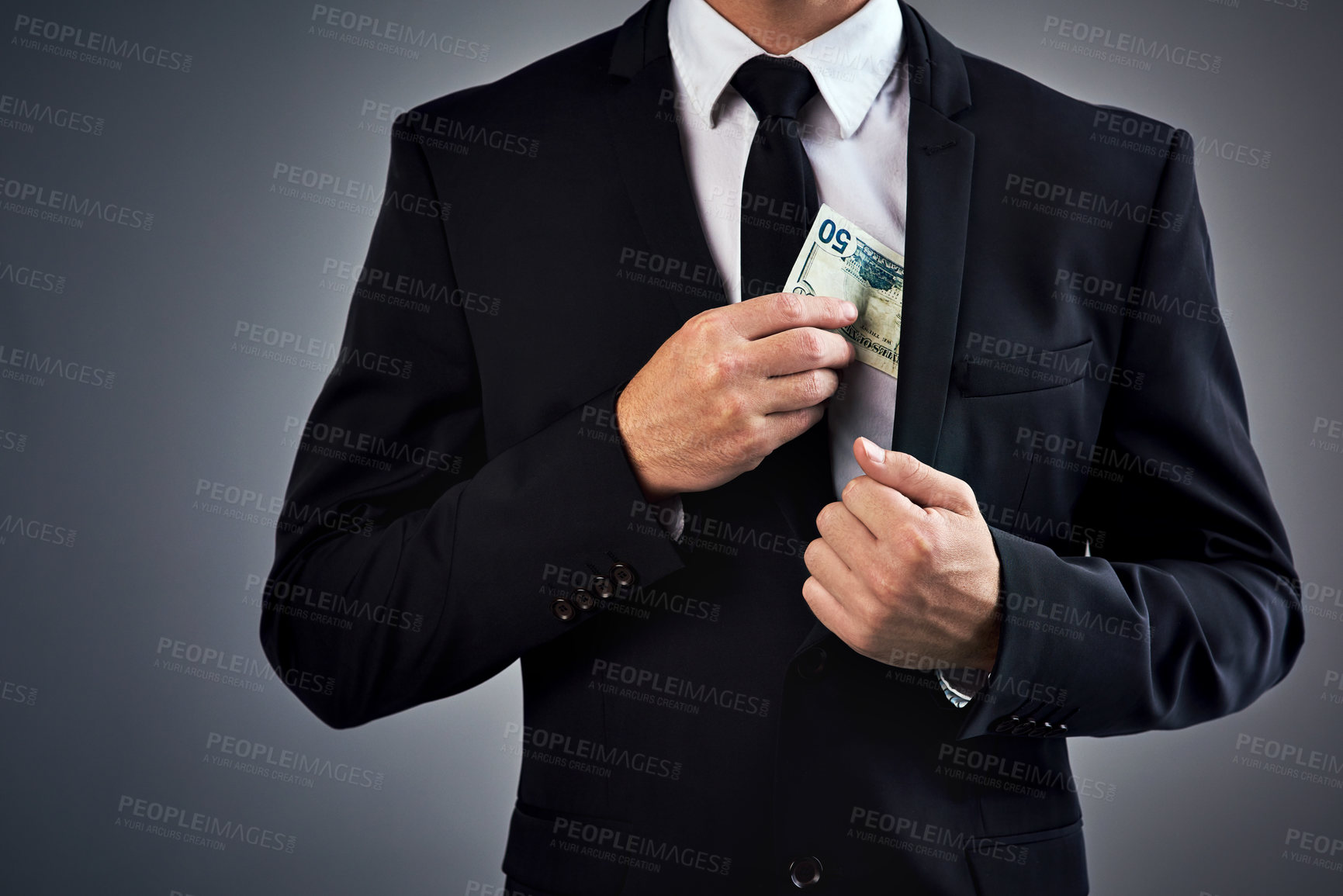 Buy stock photo Businessman, cash and bribe with fraud, scam or money laundering or corrupt lawyer payment. Model, steal and financial crime with hiding, dollar and secret illegal funds on gray studio background