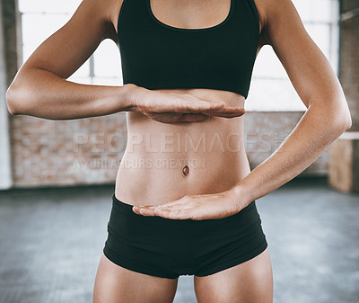 Buy stock photo Fitness, hands frame stomach and woman in gym for health, losing weight or nutrition closeup. Abs, belly and body with athlete in exercise club, framing toned tummy for goals, progress or target