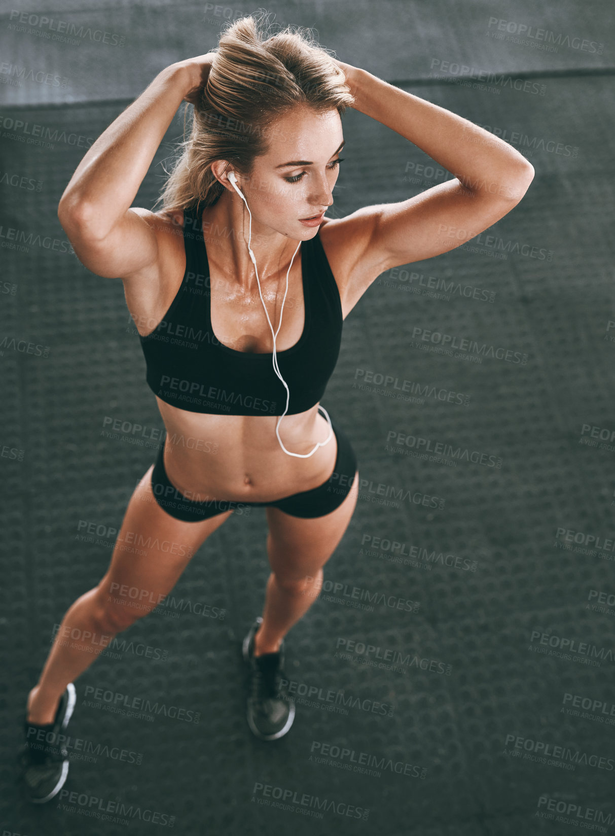 Buy stock photo Exercise, music and sweat with body of woman in gym for health challenge, training or wellness. Earphones, fitness and sexy with athlete person in sports club for physical workout from above