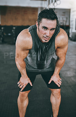 Buy stock photo Shot of a man looking exhausted after his workout