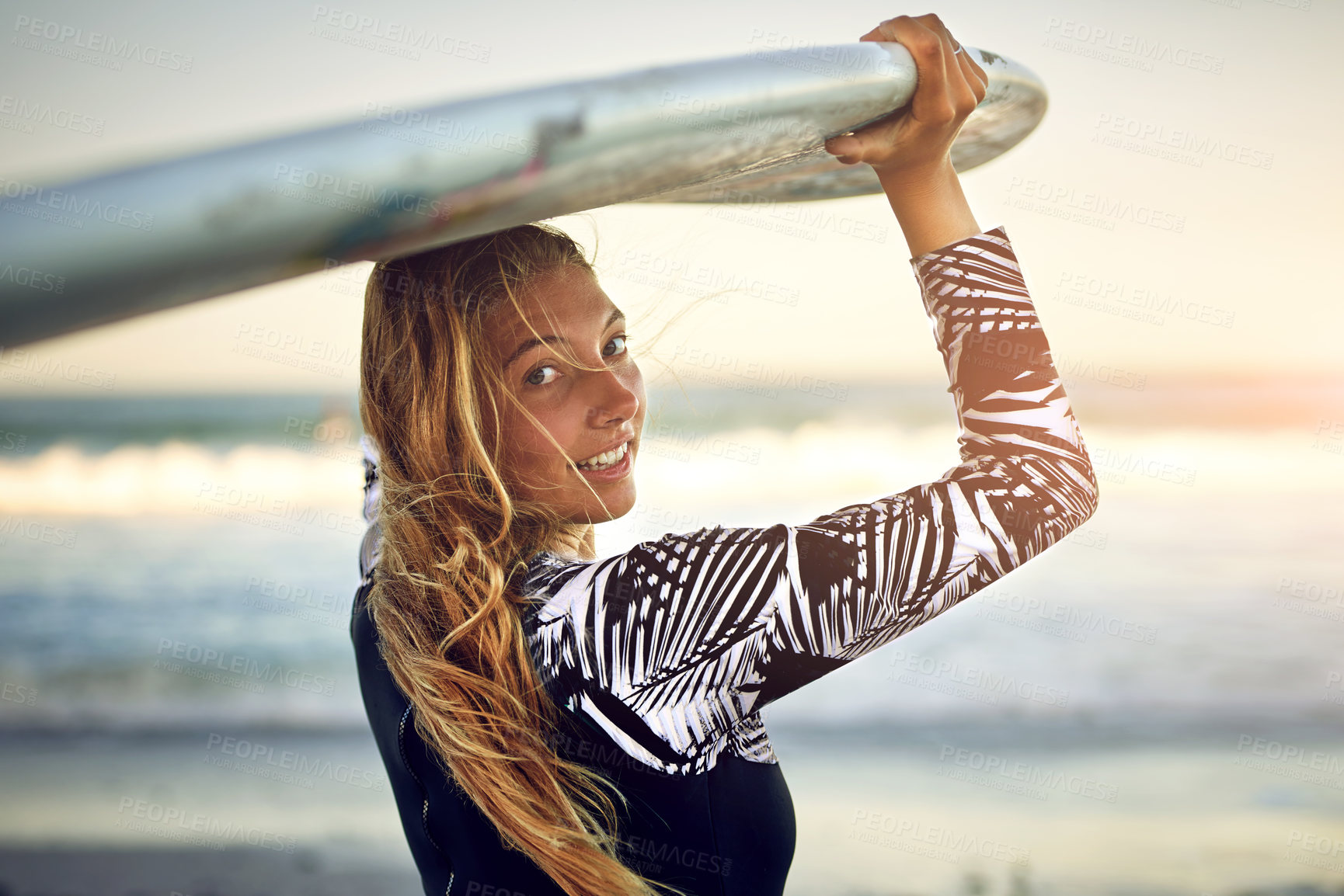 Buy stock photo Woman, surfboard on head and beach for portrait, outdoor adventure and fitness in Australia. Surfer, smile and ready at ocean for recreational activity, sport or summer vacation on island of Tasmania