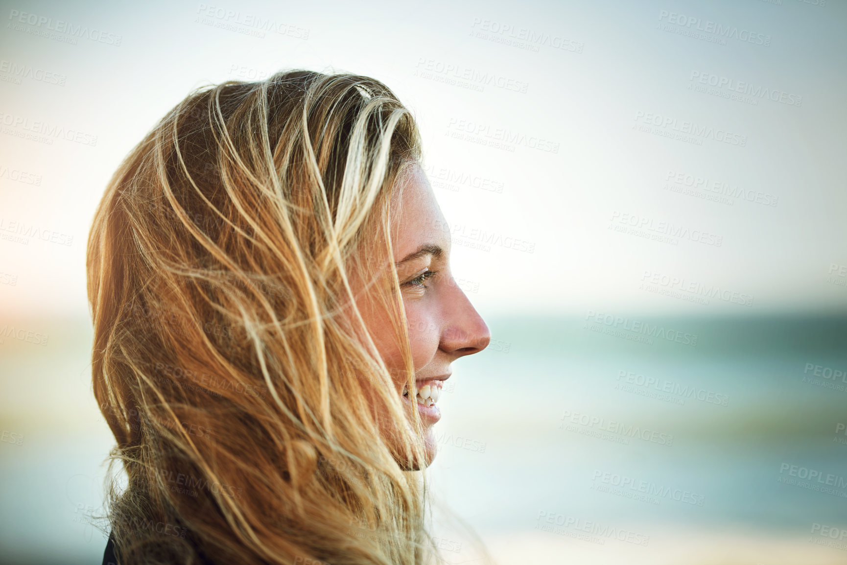 Buy stock photo Beach, woman and surfer by ocean for swimming, sport and recreation in nature for fitness or health. Female person, happy and excited for summer, freedom and adventure in waves for wellness or travel