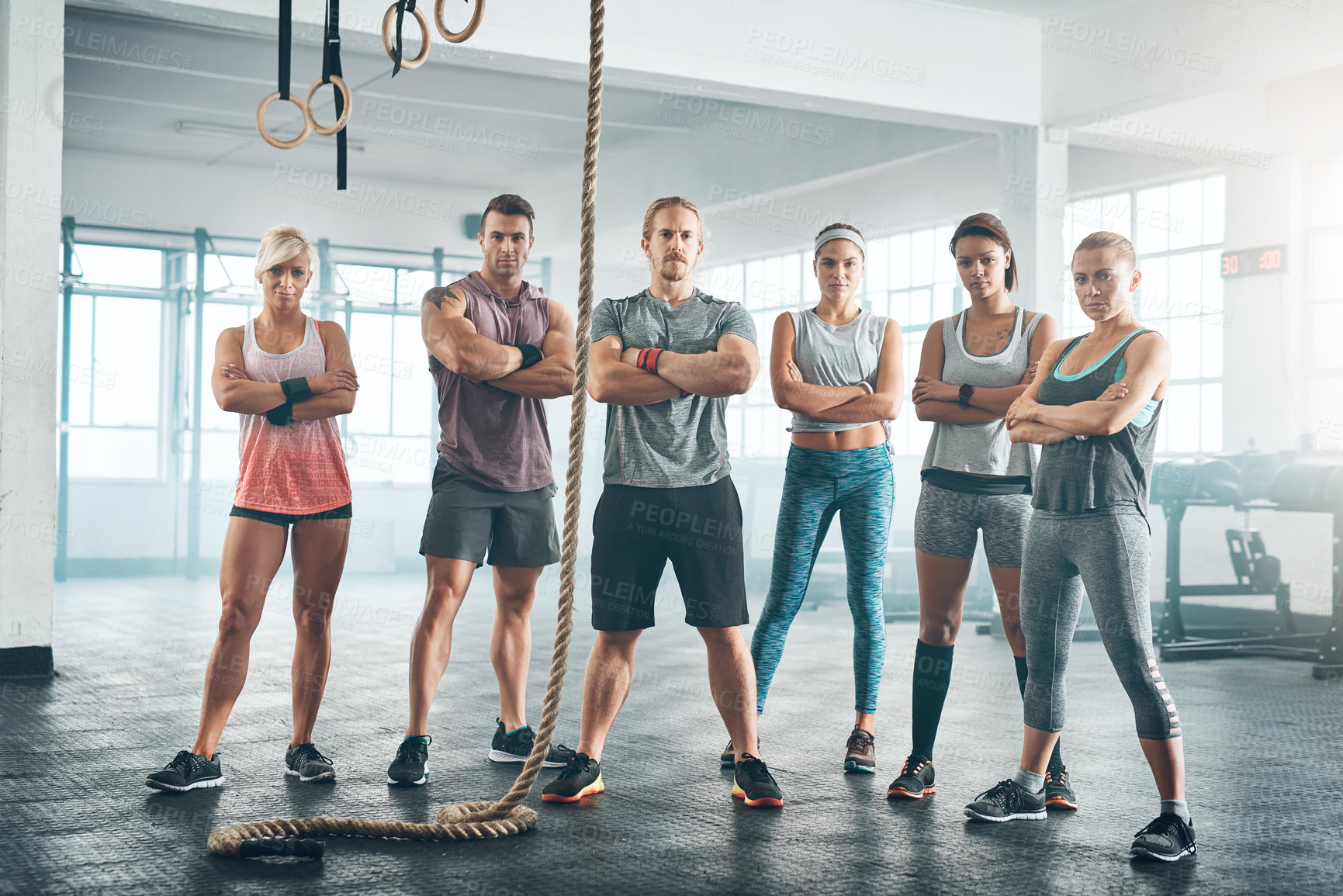 Buy stock photo Rope, portrait and group of athletes in gym for health, wellness and body workout challenge. Fitness class, friends and team of people with personal trainer for exercise together in sports center.