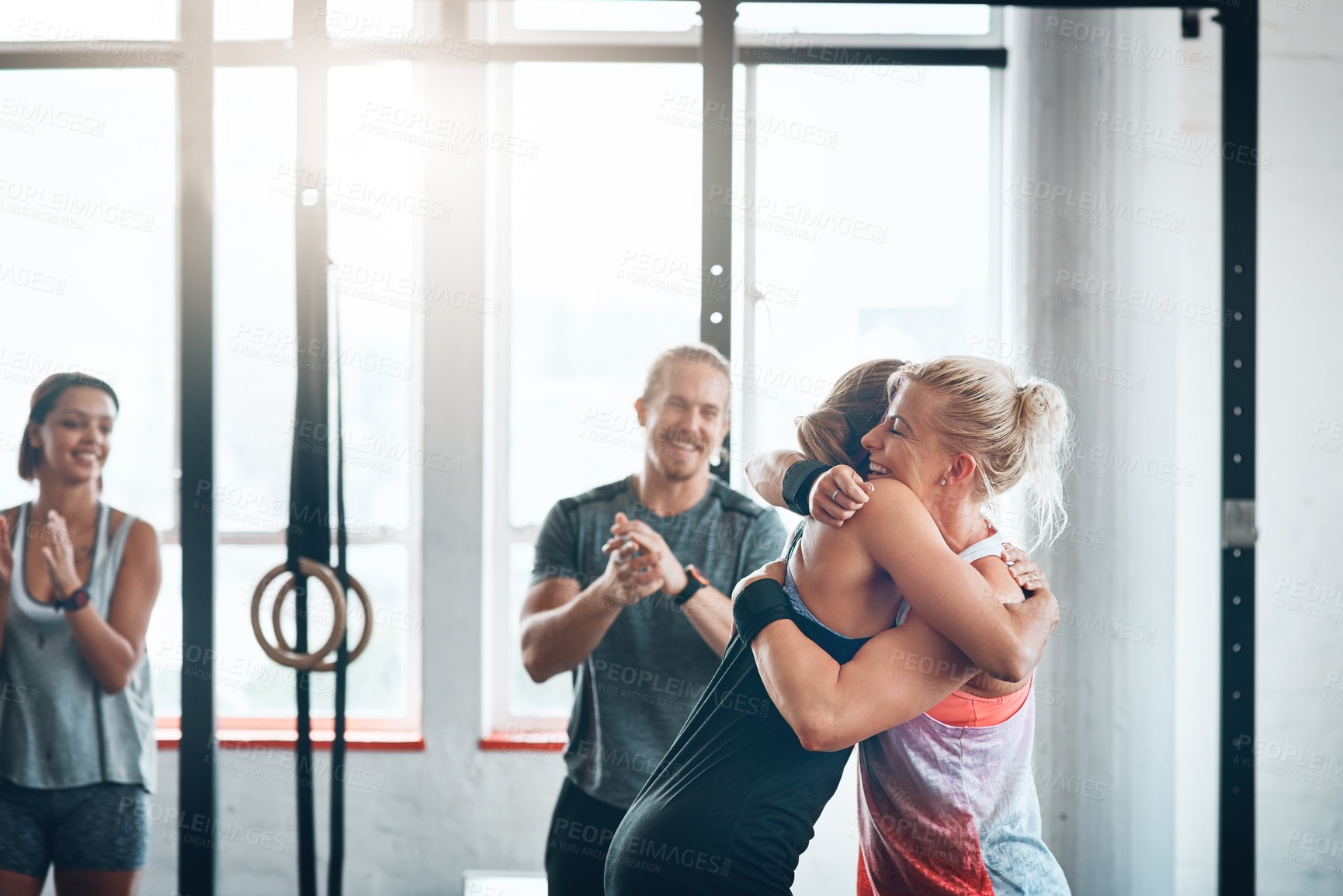 Buy stock photo Teamwork, gym and women with hug, fitness and clapping of success, athlete or celebration in club for sports. Congratulations, happy or applause for exercise, practice and people together for workout