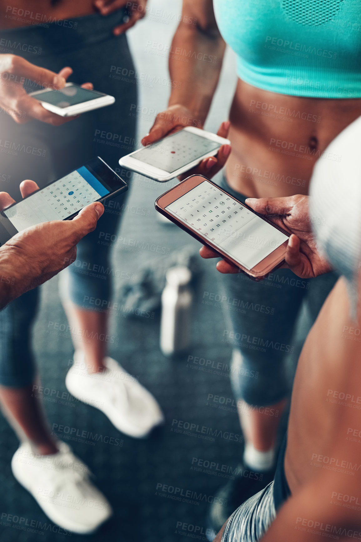 Buy stock photo Group, hands and calendar with phone for fitness schedule, workout or data sync at gym. Closeup of people on mobile smartphone or networking for training day, exercise routine or date at health club