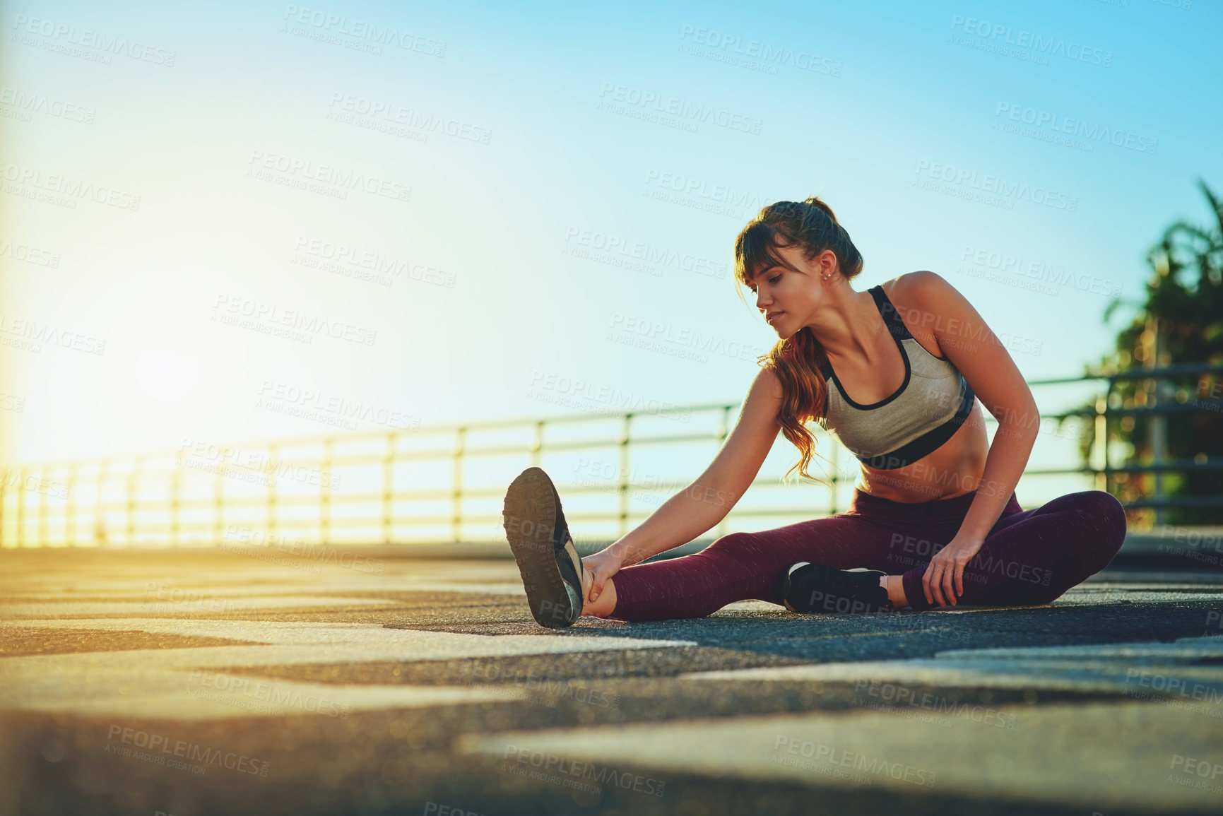 Buy stock photo Fitness, runner and stretching with woman on promenade outdoor for start of workout routine. Exercise, health and warm up with serious sports person getting ready in summer for cardio training