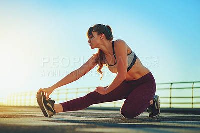 Buy stock photo Shot of a beautiful young woman out for her morning workout