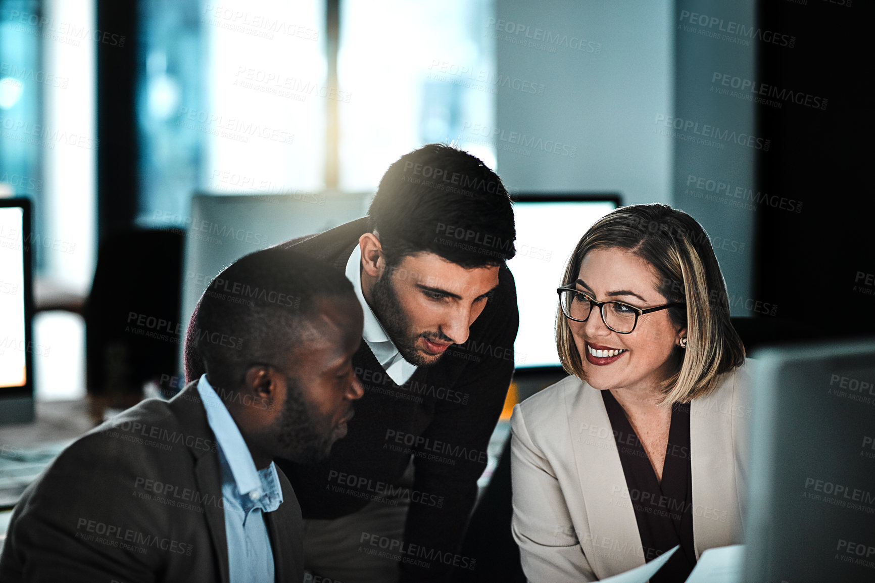 Buy stock photo Night, business people and talk in office with paperwork, computer and financial planning for project. Late, team and chat in workplace with document, budget review and problem solving for deadline.