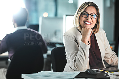 Buy stock photo Cropped shot of a businesswoman sitting at her desk