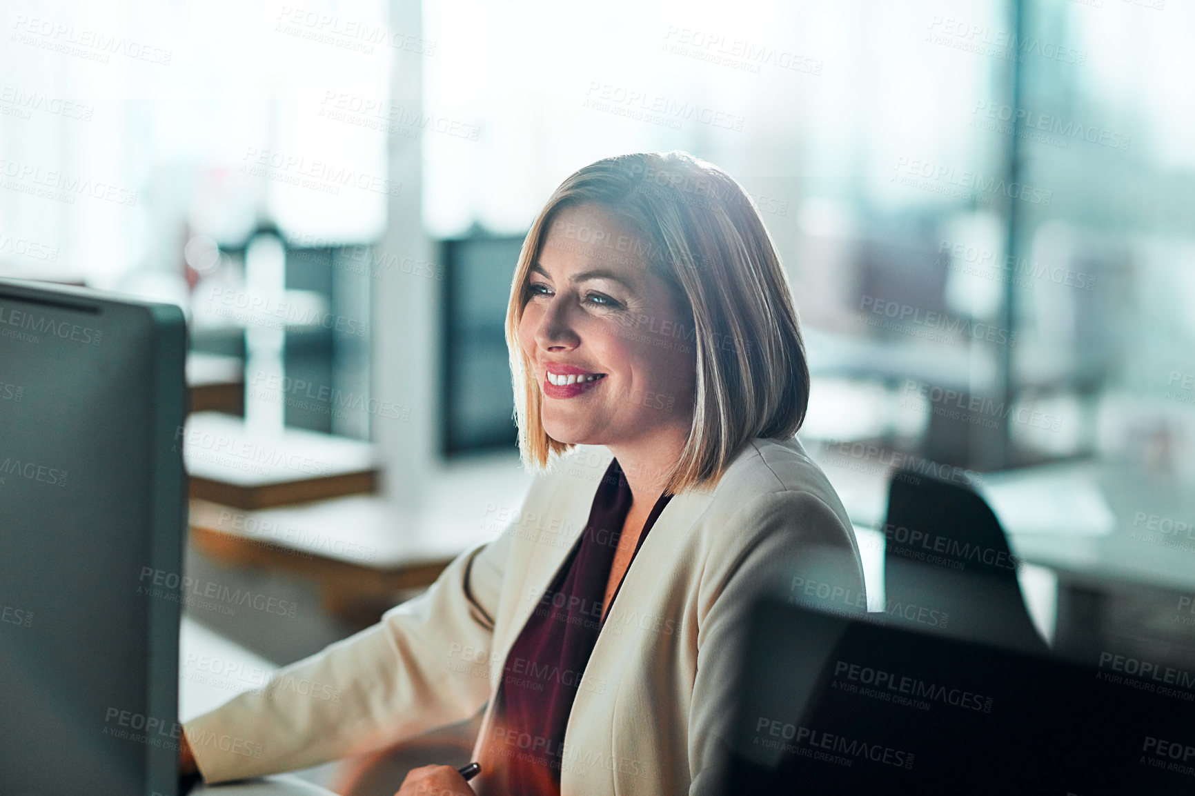 Buy stock photo Cropped shot of a businesswoman sitting at her desk