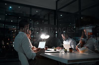 Buy stock photo Reading, night and teamwork with laptop in office, meeting and deadline for project and planning. Collaboration, online and business people, proposal and computer for financial records in boardroom