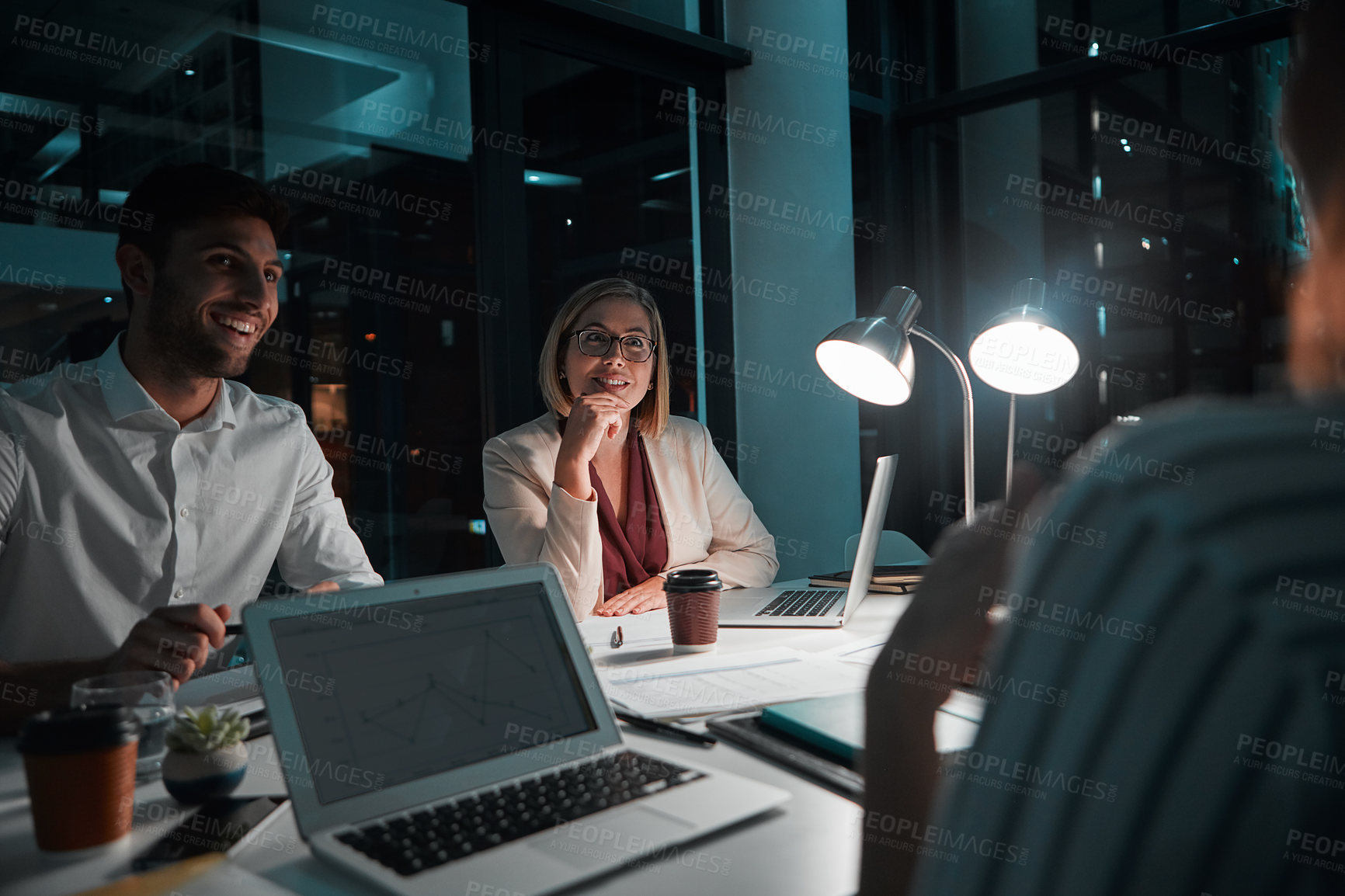 Buy stock photo Employee, happy and laptop in office at night with documents for deadline or overtime as accountant. People, partnership and teamwork for financial reviews, records and screen with statistics