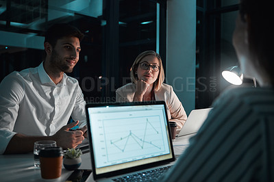 Buy stock photo Discussion, laptop and business people in office at night with stock market charts for corporate investment. Meeting, documents and financial advisors working on company profit report with deadline.