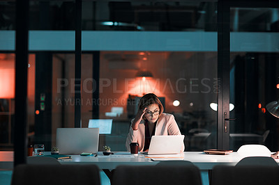 Buy stock photo Shot of a businesswoman feeling worn out during a late night at work