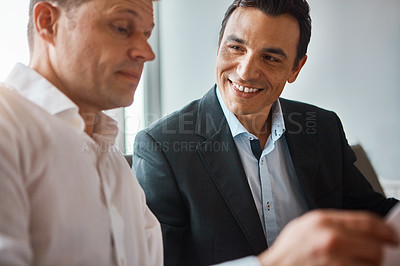 Buy stock photo Shot of two mature businessmen having a discussion in a corporate office