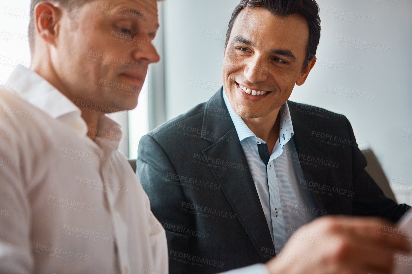 Buy stock photo Shot of two mature businessmen having a discussion in a corporate office
