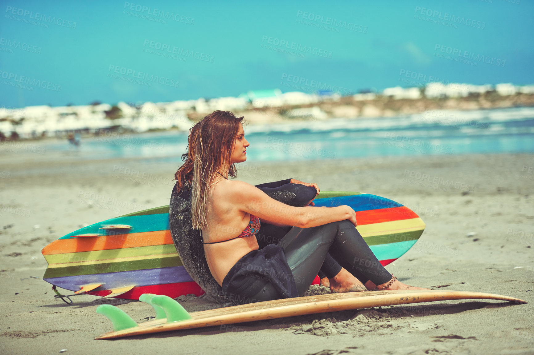 Buy stock photo Shot of a young couple surfing at the beach