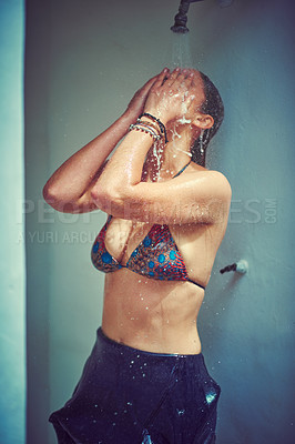 Buy stock photo Cropped shot of a woman taking a shower in her bikini