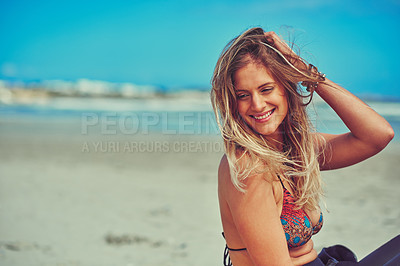 Buy stock photo Shot of a beautiful young woman enjoying a relaxing day at the beach