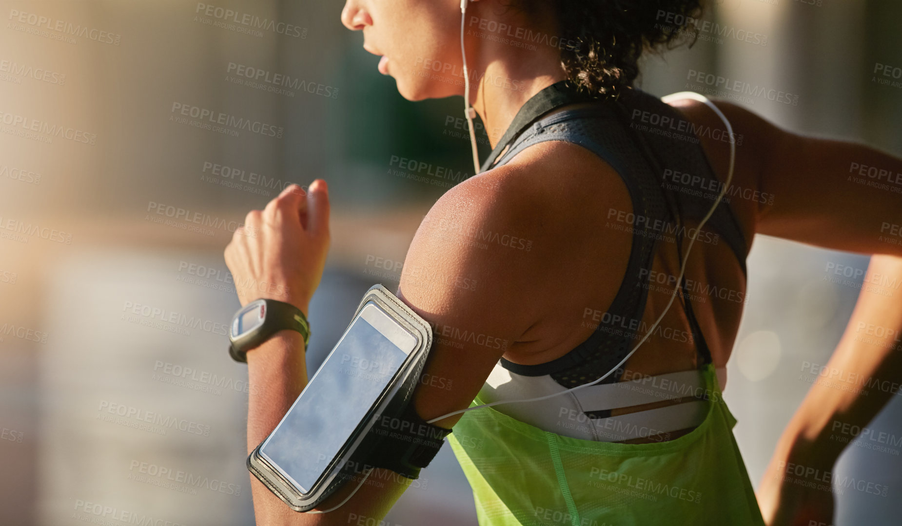 Buy stock photo Shot of a sporty young woman exercising outdoors