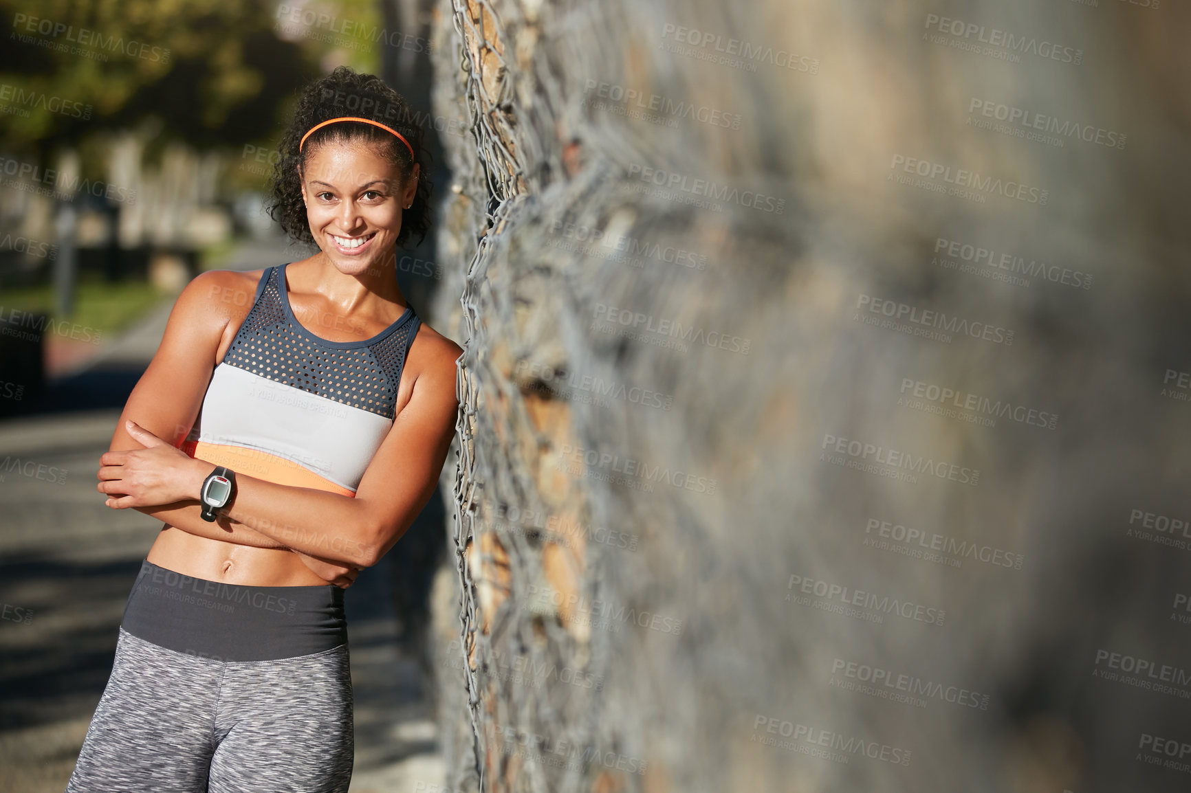 Buy stock photo Cropped portrait of an attractive young woman taking a break from her morning run