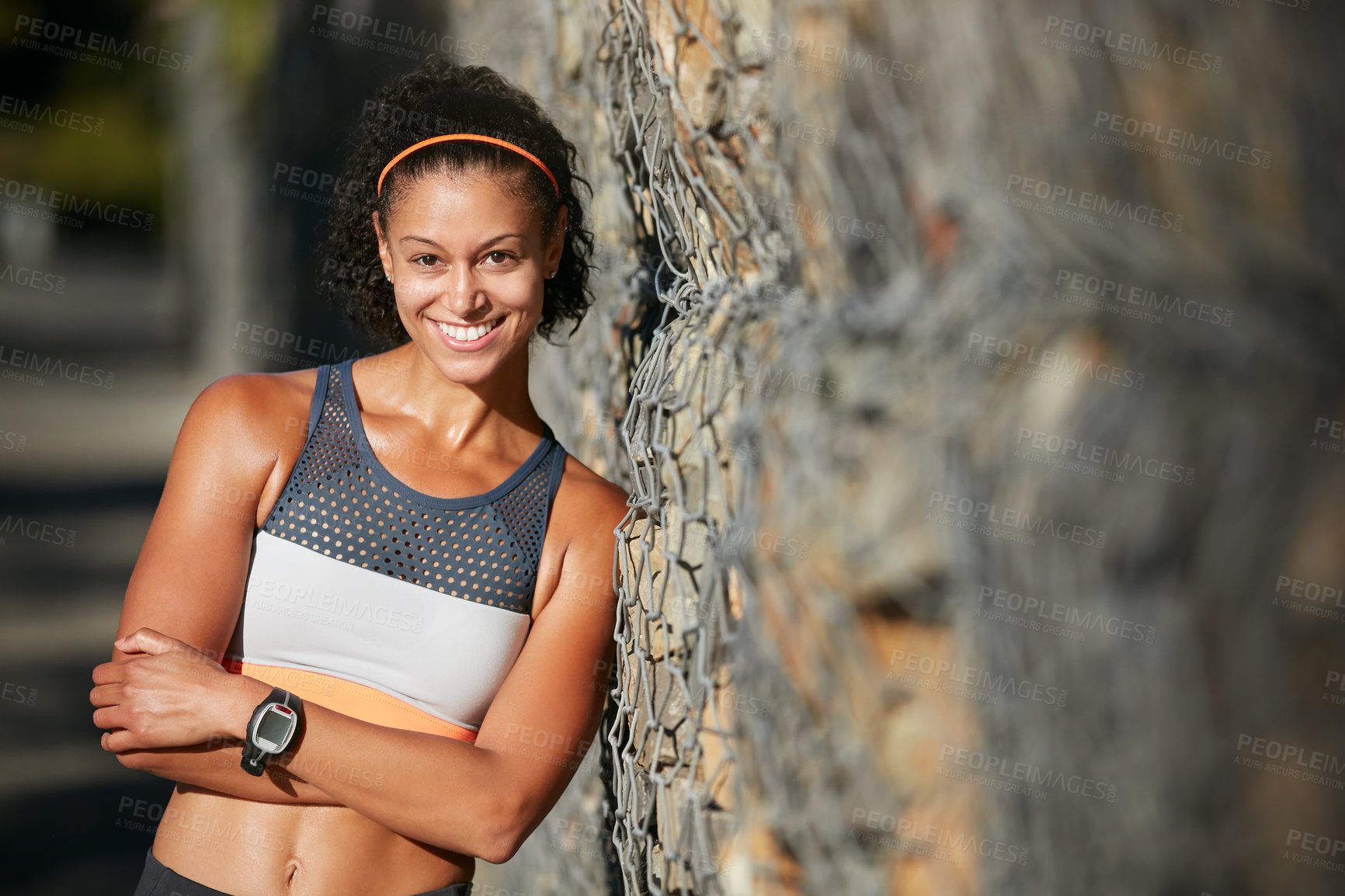 Buy stock photo Cropped portrait of an attractive young woman taking a break from her morning run