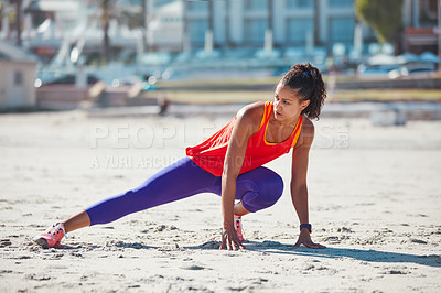 Buy stock photo Shot of a sporty young woman practising her exercise routine