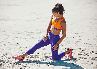 Buy stock photo Shot of a sporty young woman practising her exercise routine