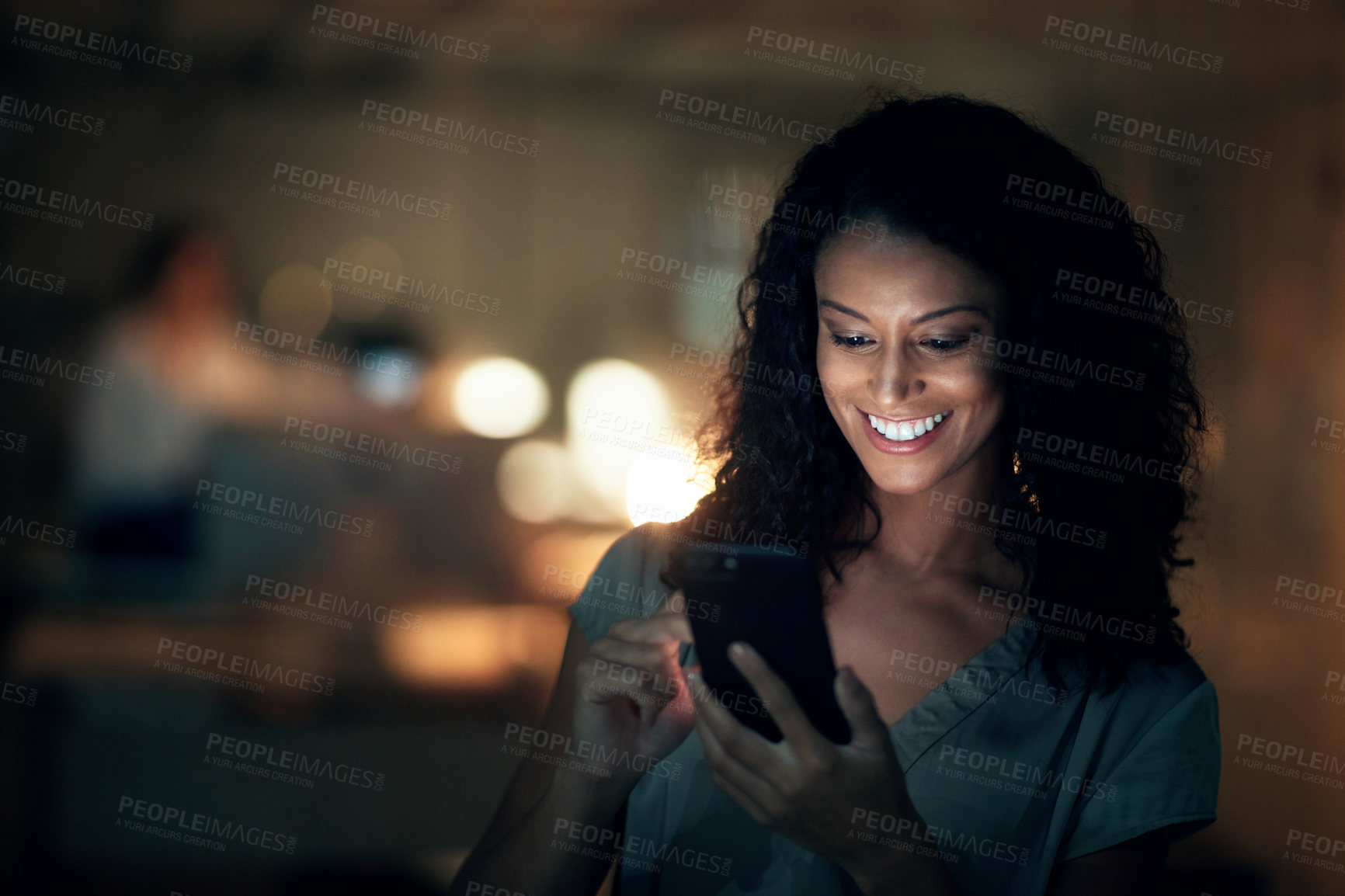 Buy stock photo Business, night and woman with cellphone, smile and internet with connection, social media and typing. African person, employee or consultant with smartphone, evening and scrolling for message or joy